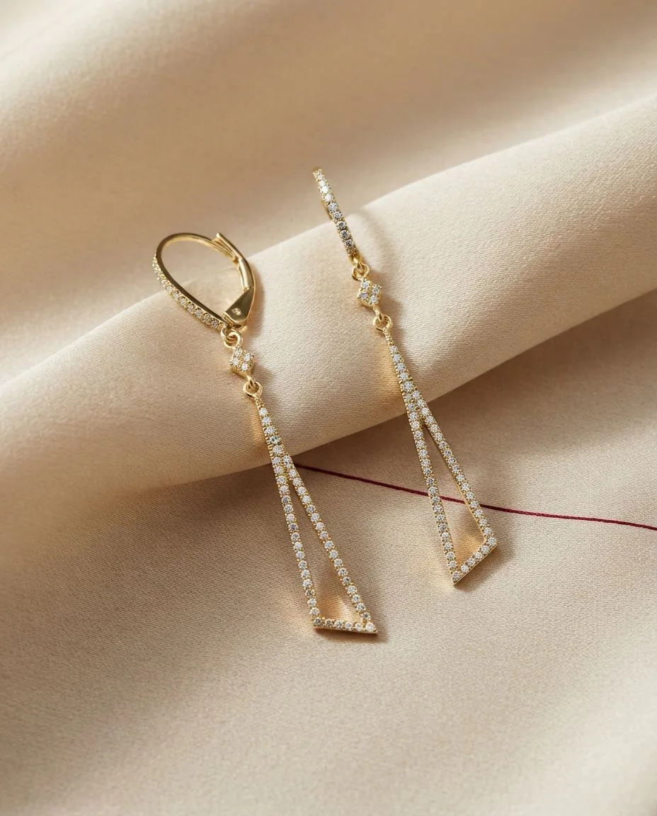 Ohrschmuck 18 Karat Gelbgold · drapiert