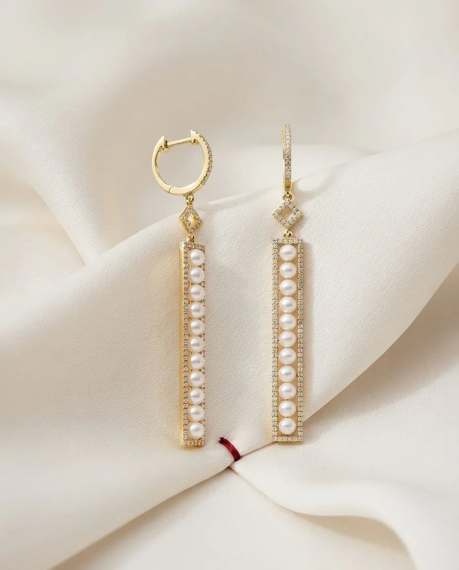 Ohrschmuck 18 Karat Gelbgold · drapiert