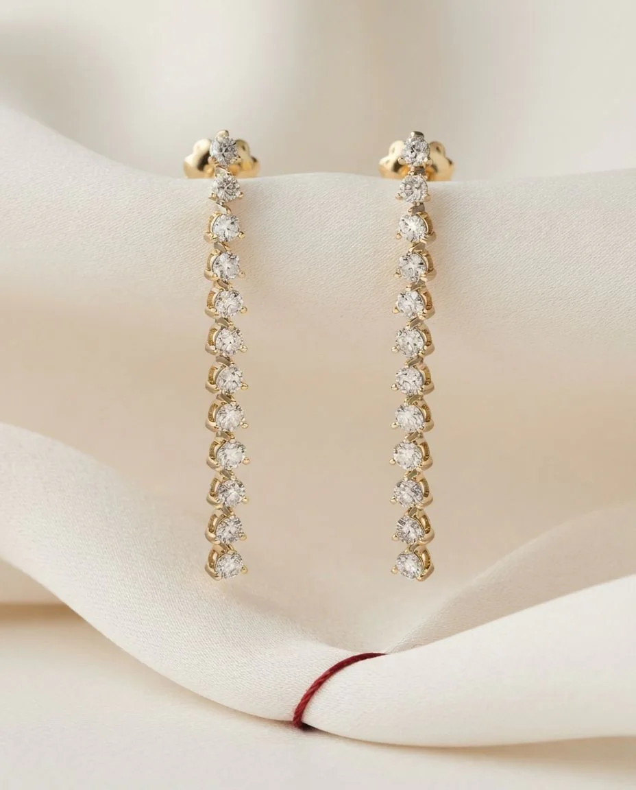 Ohrschmuck 18 Karat Gelbgold · drapiert