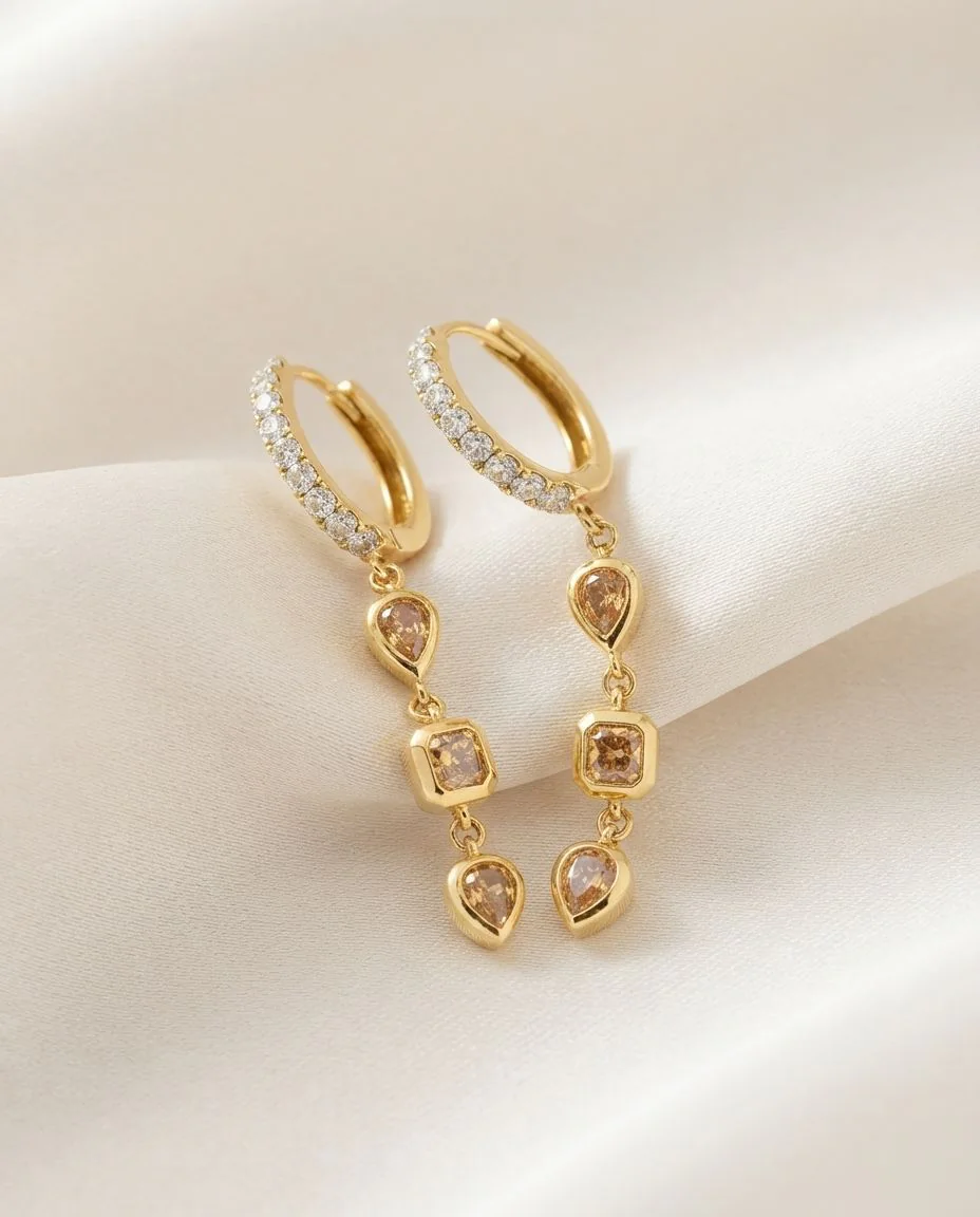 Ohrschmuck 18 Karat Gelbgold · drapiert
