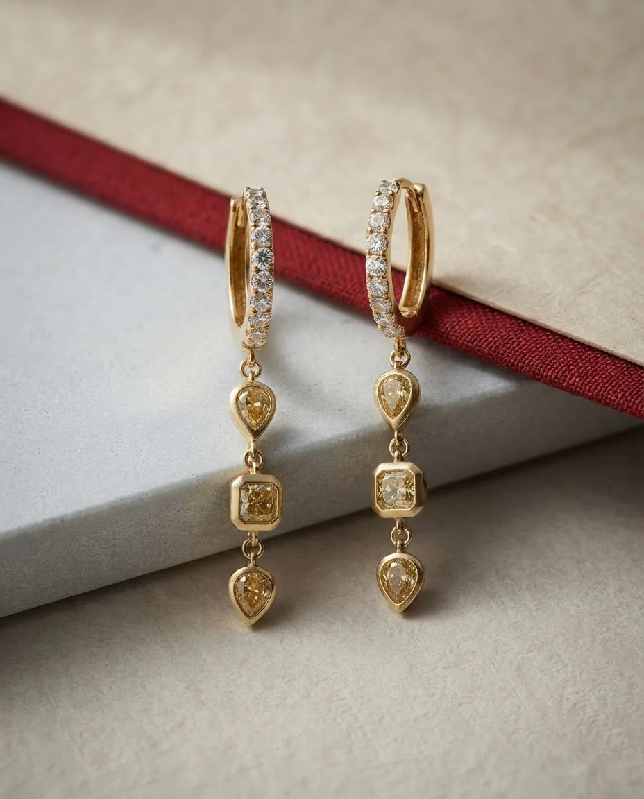 Ohrschmuck 18 Karat Gelbgold · drapiert