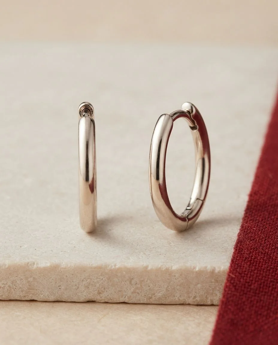 Creolen 18 Karat Gelbgold · drapiert