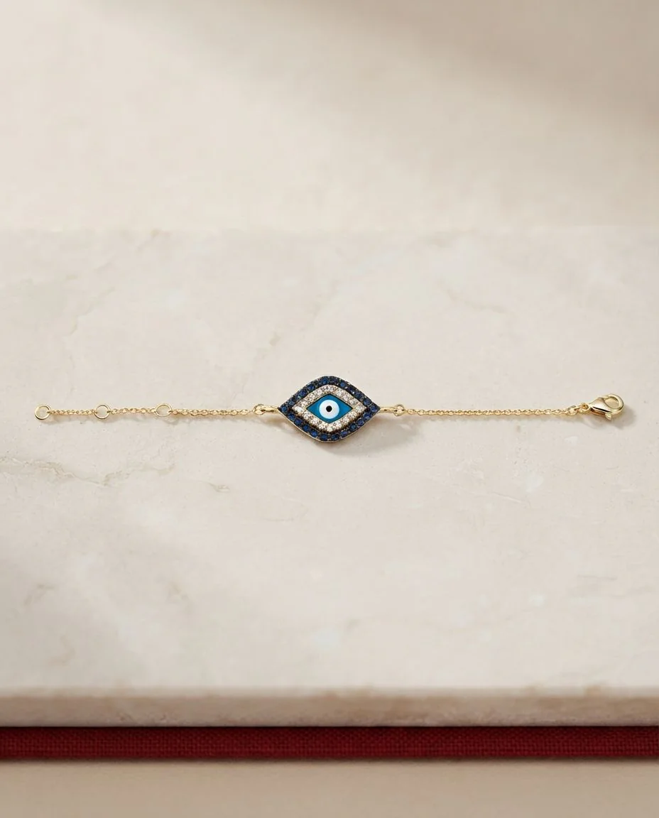 Armband 18 Karat Gelbgold Auge, Fassung schwarz rhodiniert · drapiert