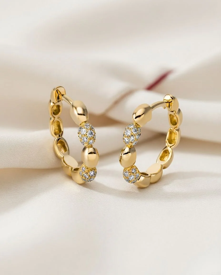 Creolen 18 Karat Gelbgold · drapiert