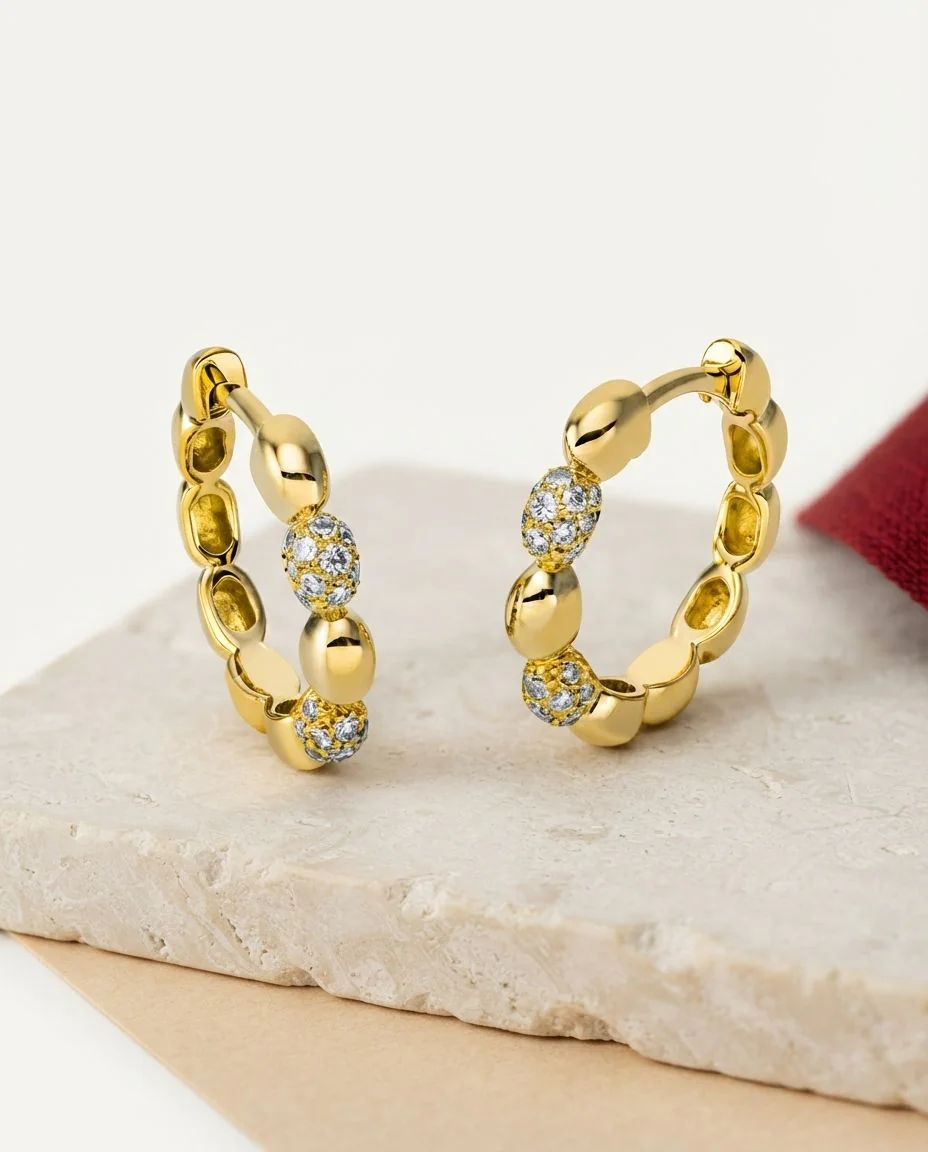 Creolen 18 Karat Gelbgold · drapiert