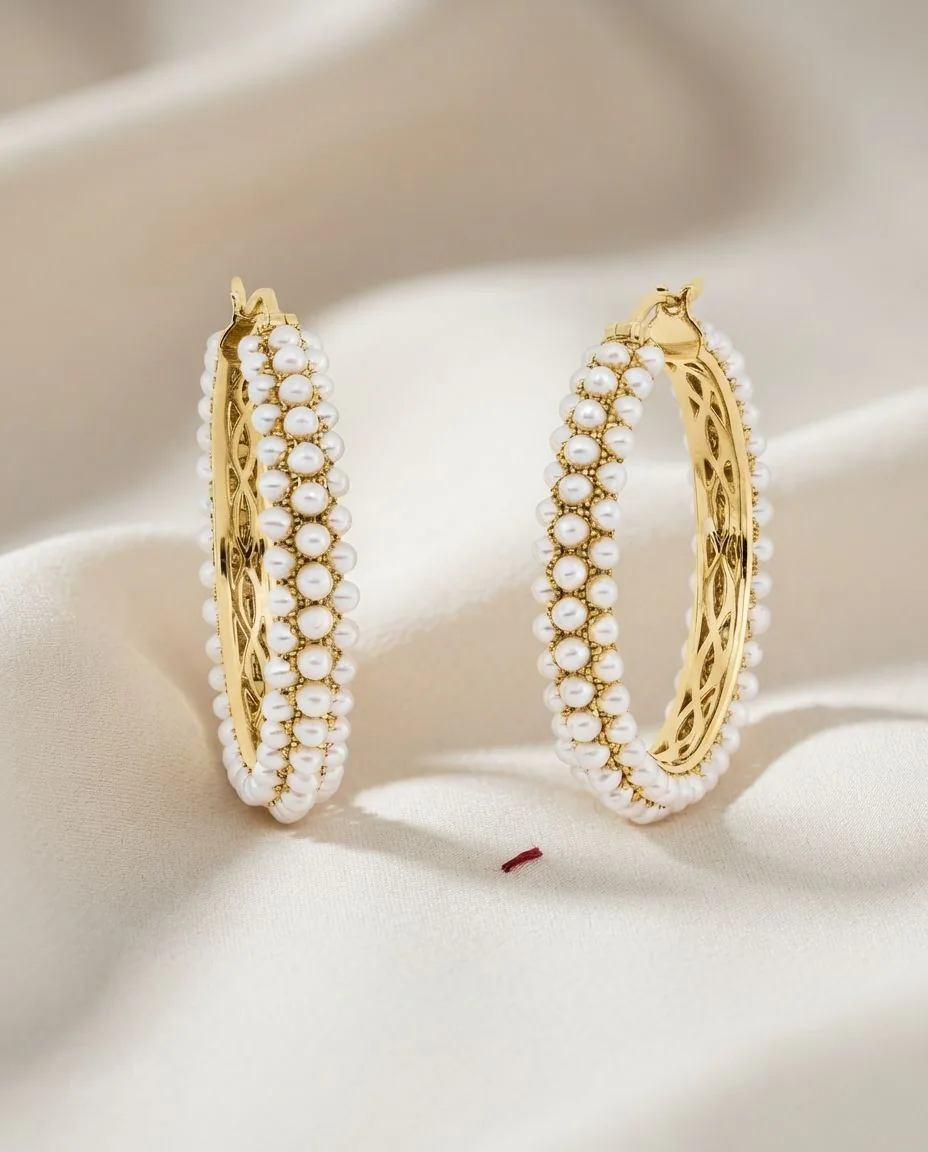 Creolen 18 Karat Gelbgold · drapiert