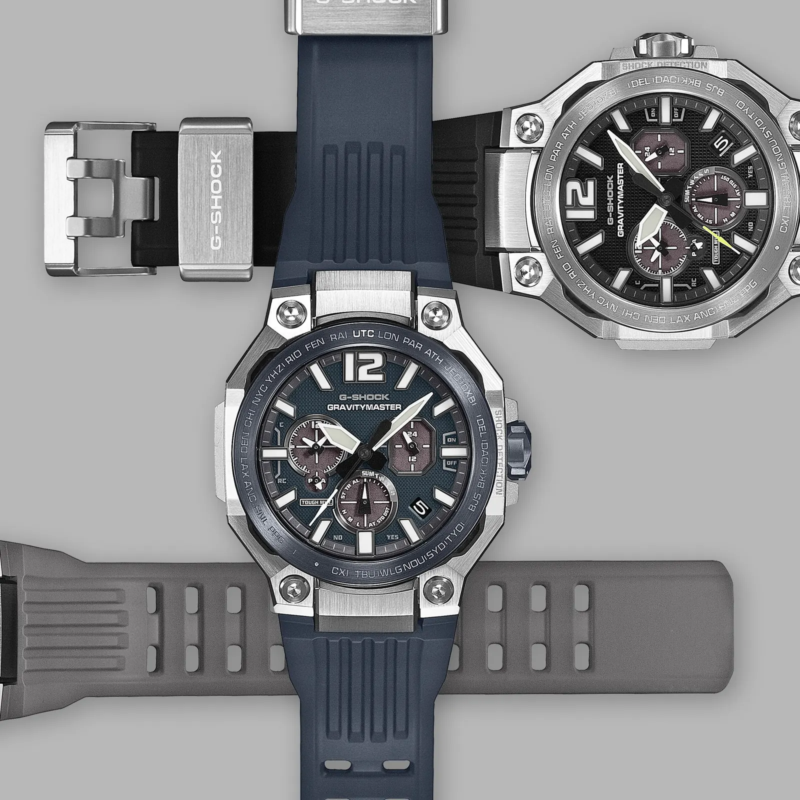 Drei Farbvarianten des Modells GRW-B3000 mit grauem, blauem und schwarzem Armband liegen gekreuzt übereinander