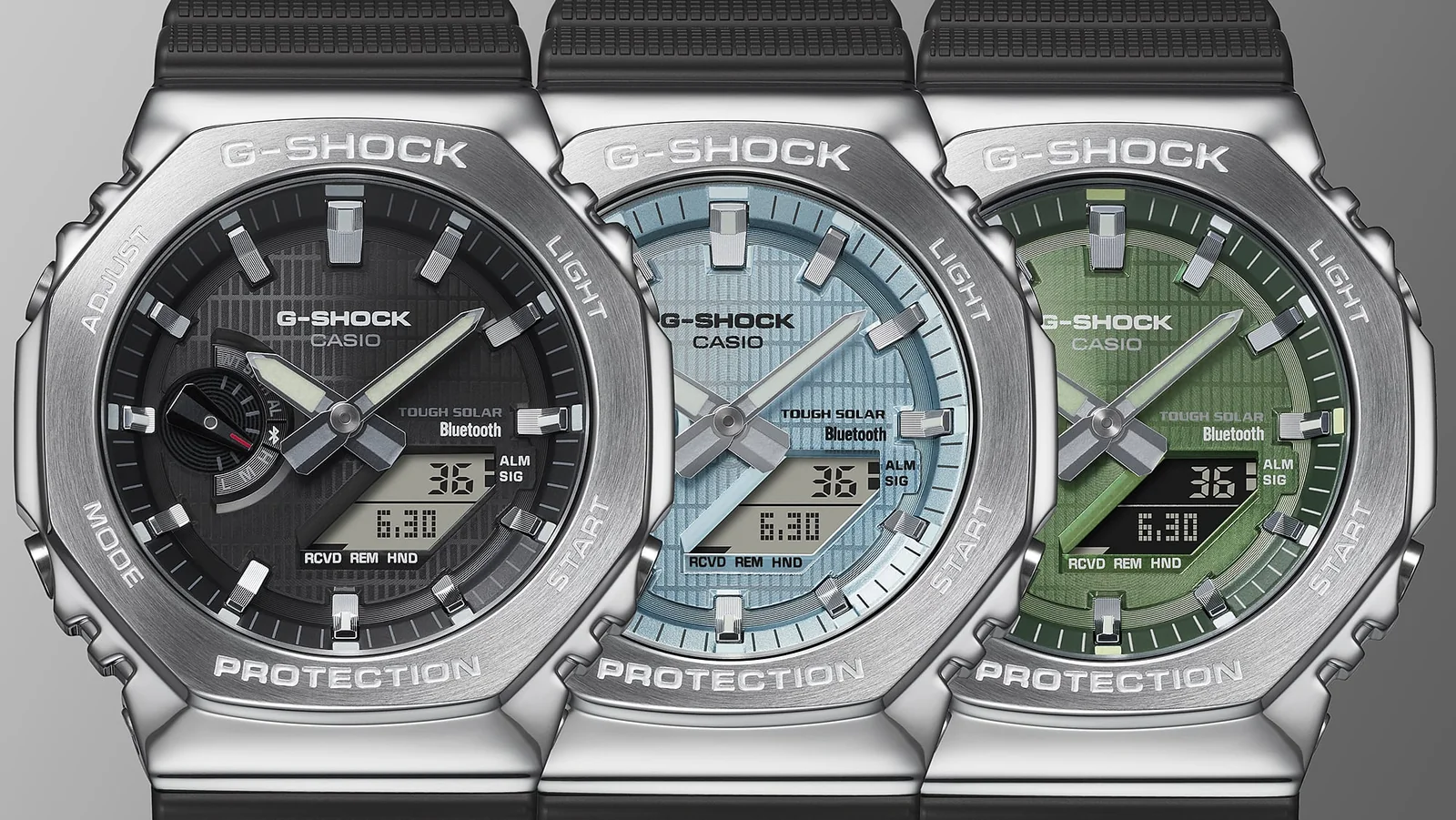 Die G-SHOCK Armbanduhr GBM-2100A-1A3 neben zwei ähnlichen Modellen mit schwarzem bzw. hellblauem Zifferblatt.