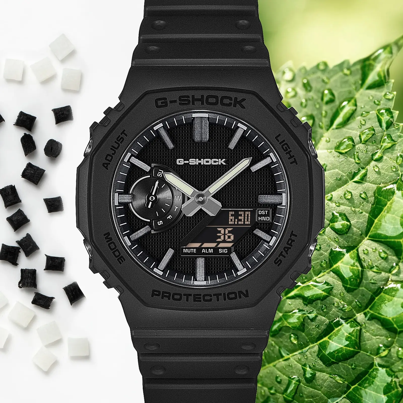 Die Armbanduhr GA-2100LXB-1AER ist neben einem grünen Blatt mit Wassertropfen und kleinen Kügelchen des biobasierten Resins abgebildet